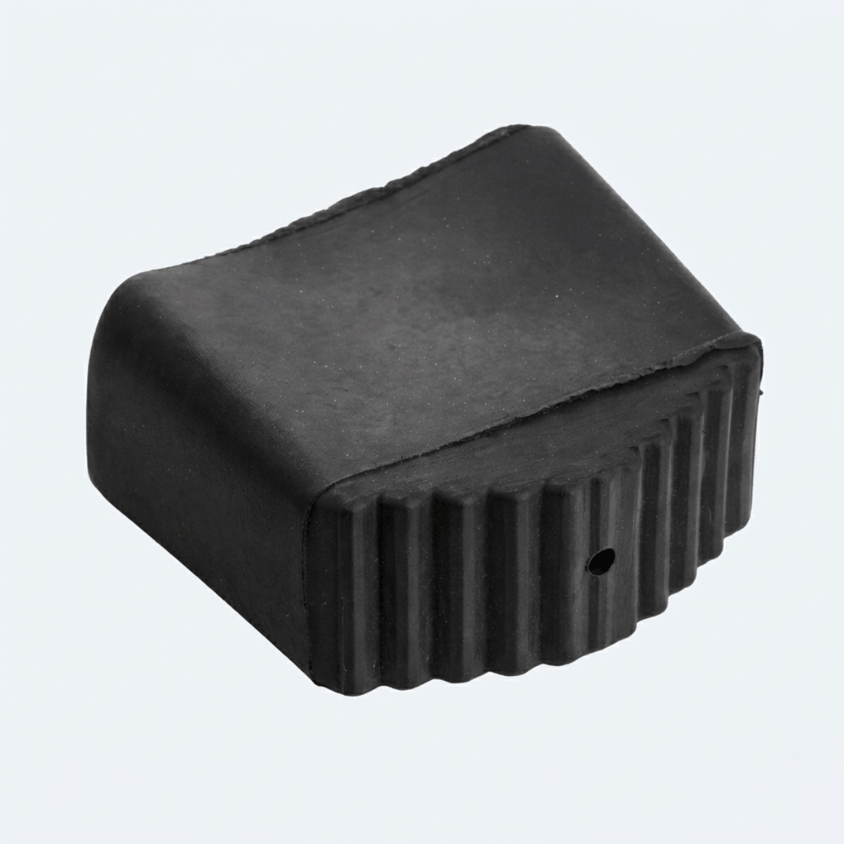 A black rubber or foam protective cover with a ribbed, stepped edge and a small circular hole on one side, shown on a plain light gray background.