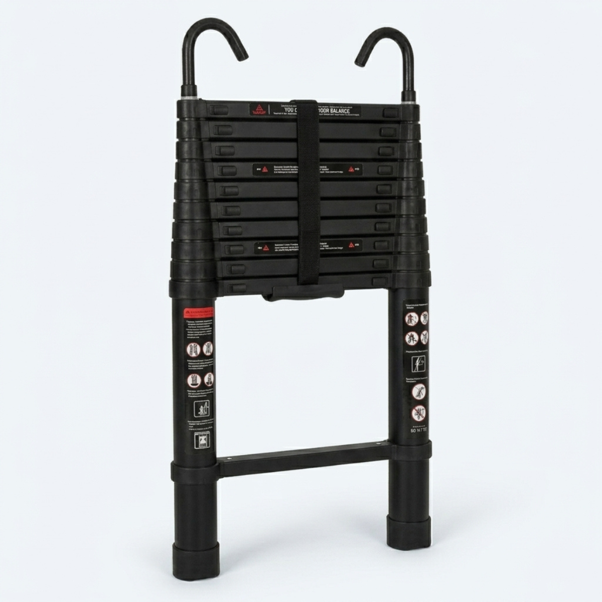 A black telescoping extension ladder shown fully extended against a light gray studio background. The ladder has two upright legs with safety labels, a central support beam, and two curved top handles or hooks.